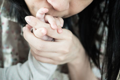 Close-up of woman holding hands