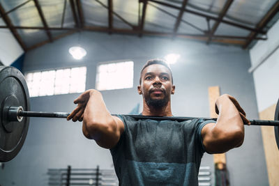 Man lifting weights in gym