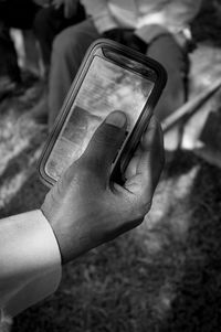 Close-up of man using mobile phone