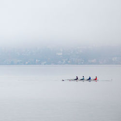 People kayaking in sea