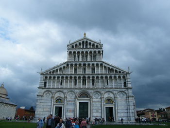 Group of people in front of historical building