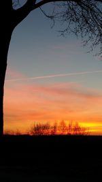 Silhouette landscape against sky during sunset