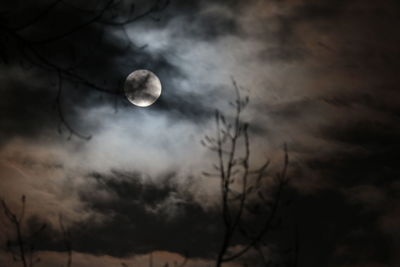 Low angle view of cloudy sky at night