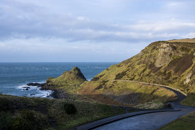 Road by sea against sky