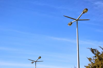 Low angle view of street light against sky