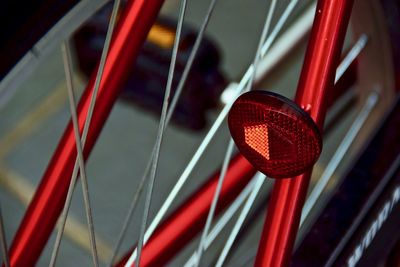 Close-up of red heart shape hanging on metal