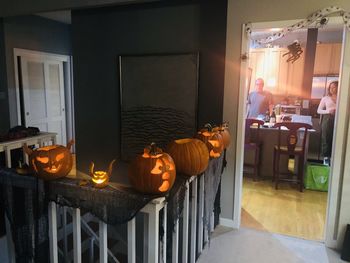 Illuminated lanterns by house in building