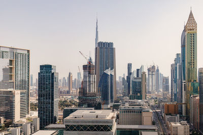 Skyscrapers in city against sky