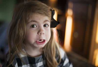 Close-up portrait of girl making a face