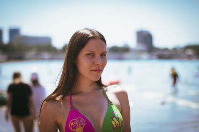 Portrait of woman in bikini top at beach