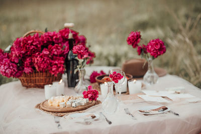 View of red roses on table