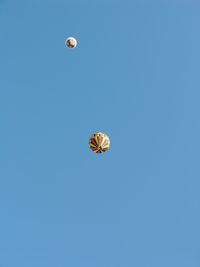 Low angle view of moon against blue sky