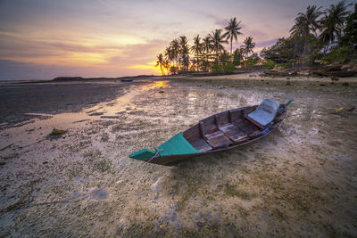 Scenic view of beach against sky during sunset