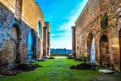 Old ruin building against cloudy sky