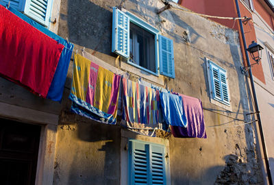 Low angle view of clothes drying on building