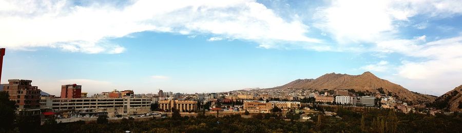 Panoramic view of cityscape against sky