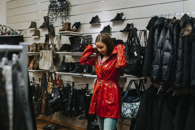 Young woman in clothes shop