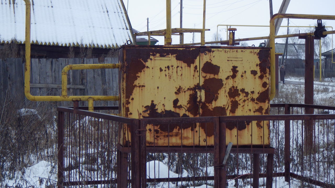 snow, no people, day, nature, urban area, winter, metal, cold temperature, rusty, wood, architecture, outdoors, abandoned, fence, damaged, tree, built structure, transport, sky