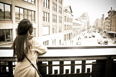 Woman standing on street in city