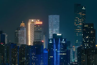 Illuminated buildings in city at night