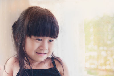 Close-up portrait of smiling girl