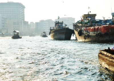 View of fishing bot in sea at city