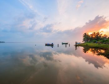 Scenic view of lake against sky during sunset