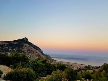 Scenic view of mountains against sky at dusk