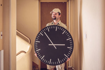 Full length of man in clock