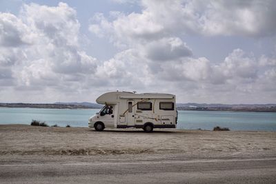 Travel trailer against lake
