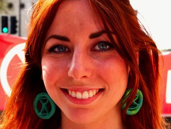 Close-up portrait of smiling young woman