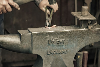 Close-up of man working at workshop