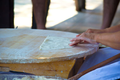 Cropped hands of woman preparing food