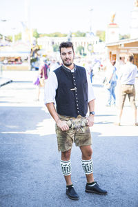 Portrait of man standing on street at event