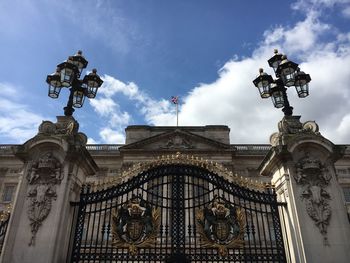 Low angle view of building against cloudy sky