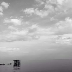Scenic view of sea against cloudy sky