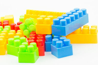 Close-up of multi colored toy blocks on white background