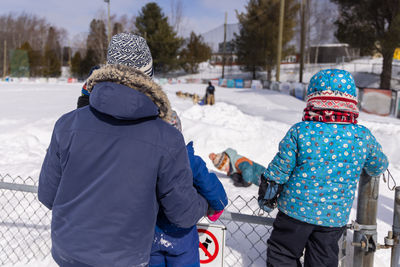 Rear view of man skiing on snow