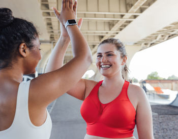 Young woman exercising in gym