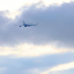 Low angle view of airplane flying in sky