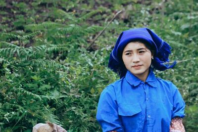 Portrait of a smiling young woman in rain