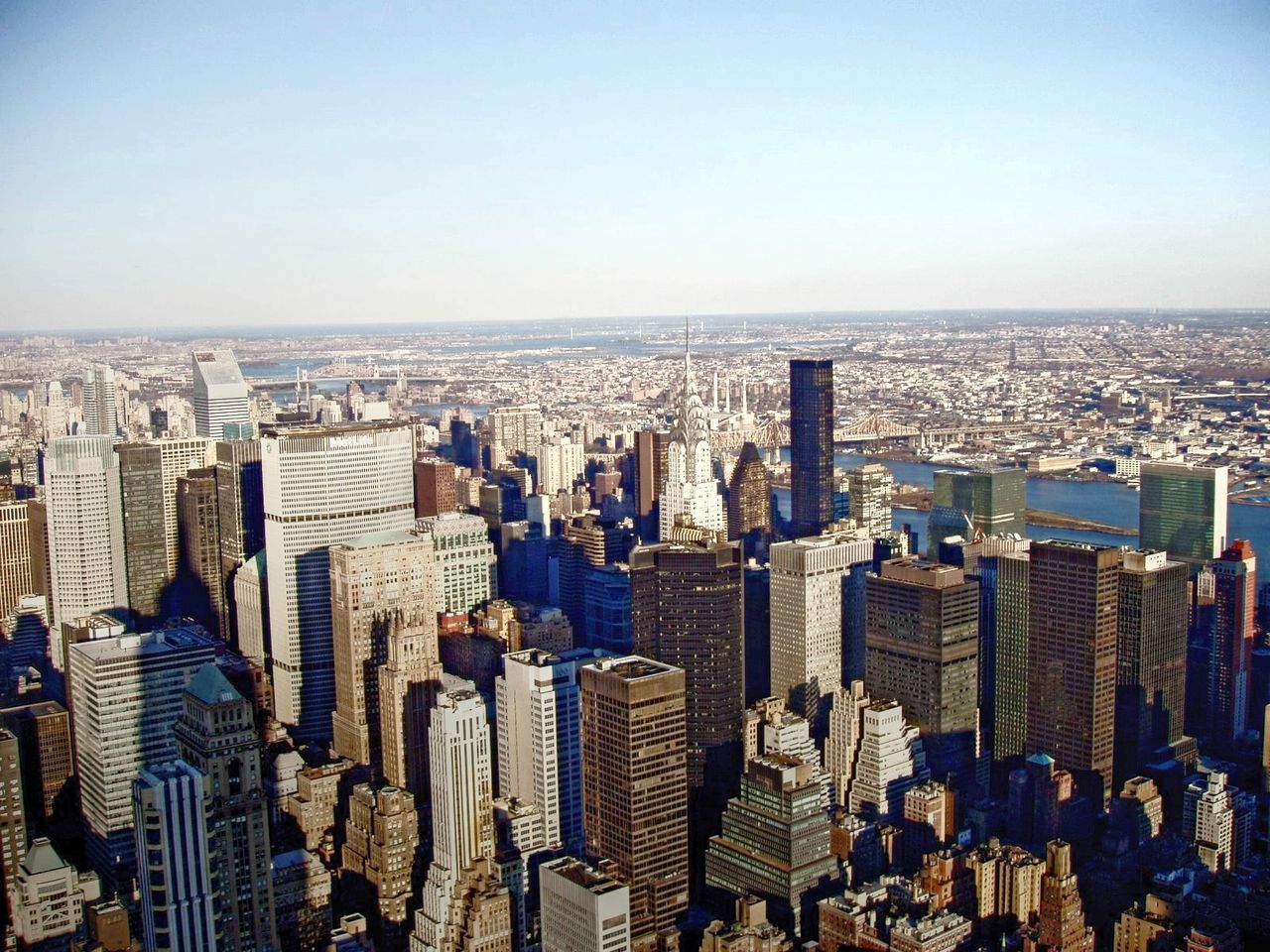 Chrysler building amidst cityscape against sky