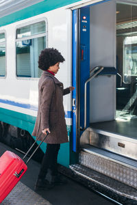 Tourist woman going for vacation trip on train