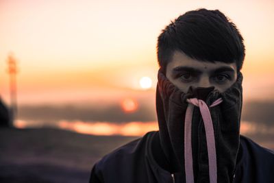 Portrait of young man at sunset