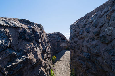 Rock formations against clear blue sky
