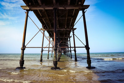 Pier on sea against sky