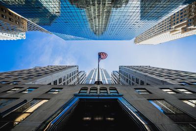 Low angle view of skyscraper against sky in city