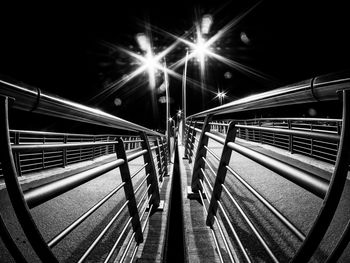 Light trails on bridge in city at night