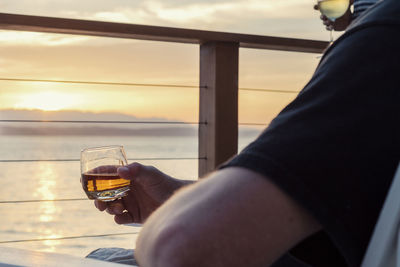 Close-up of man drinking whiskey