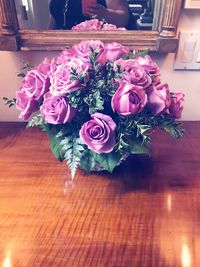 Close-up of pink roses on table